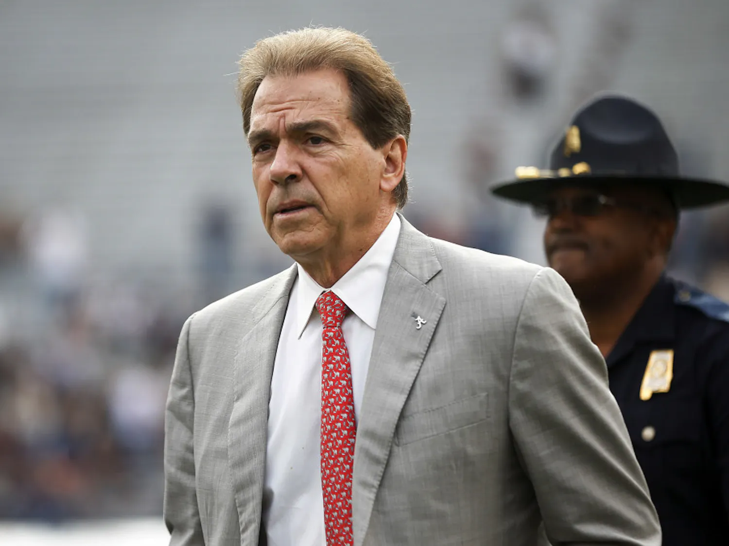FILE - In this Nov. 25, 2017, file photo, Alabama head coach Nick Saban walks the field before the Iron Bowl NCAA college football game against Auburn, in Auburn, Ala. The Associated Press voters prefer Alabama over Ohio State. In the final Top 25 of the regular season, the Crimson Tide was No. 4 and the Buckeyes were No. 5. (AP Photo/Brynn Anderson, File)