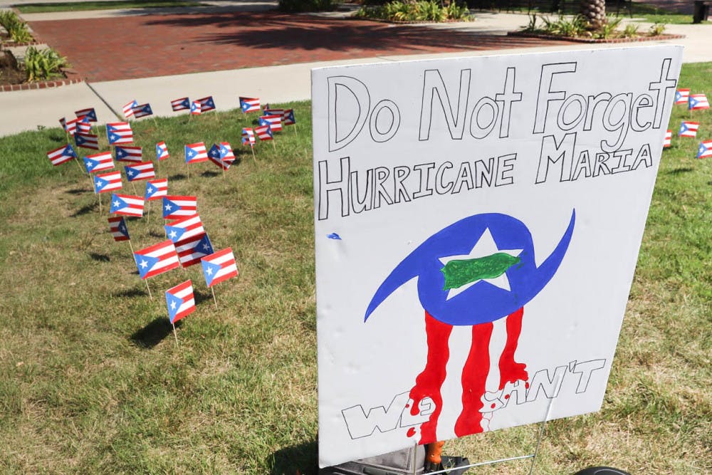 Puerto Rican flags planted on the Plaza of the Americas in the shape of “PR” honored the victims of Hurricane Maria who died on the island on the anniversary of the hurricane. Unión de Estudiantes Puertorriqueños Activos, the Puerto Rican UF student group under the umbrella of Hispanic Student Association, collected books to send to a library and signed a poster offering words of hope to those still affected.