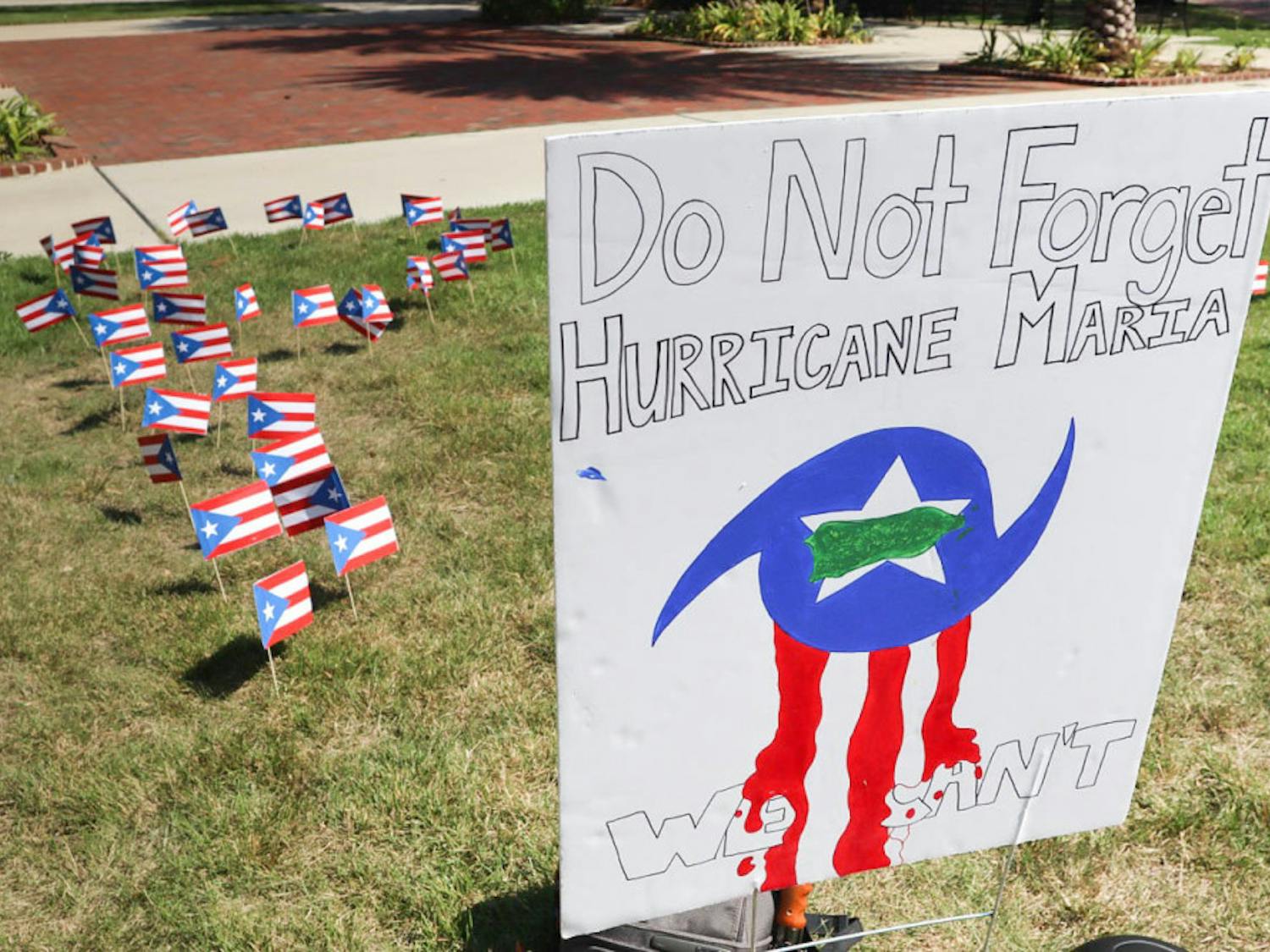 Puerto Rican flags planted on the Plaza of the Americas in the shape of “PR” honored the victims of Hurricane Maria who died on the island on the anniversary of the hurricane. Unión de Estudiantes Puertorriqueños Activos, the Puerto Rican UF student group under the umbrella of Hispanic Student Association, collected books to send to a library and signed a poster offering words of hope to those still affected.