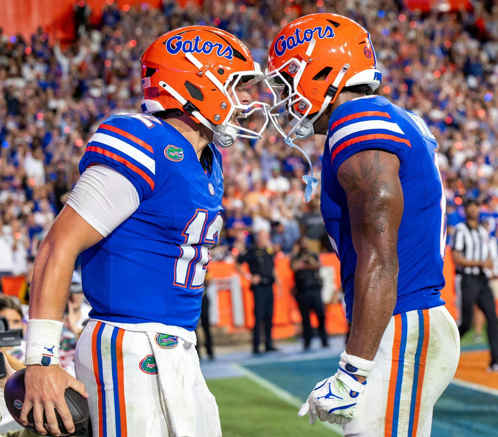 Florida quarterback Aaron Philo (12) celebrates after making a touchdown during the first half of an NCAA college football game against FAU, Saturday, Sept. 5, 2026, in Gainesville, Fla.