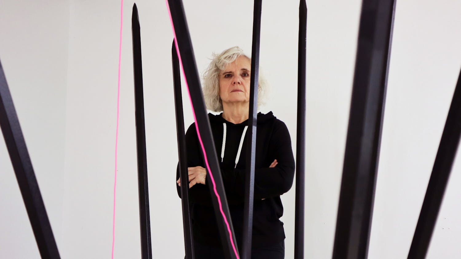 Charlotte Newman and her protest piece “Women’s Reproductive Health 2022,” which features nine steel knitting needles and a pink string representing the fragility of women’s rights in the Supreme Court’s hands Saturday, Nov. 19, 2022. 