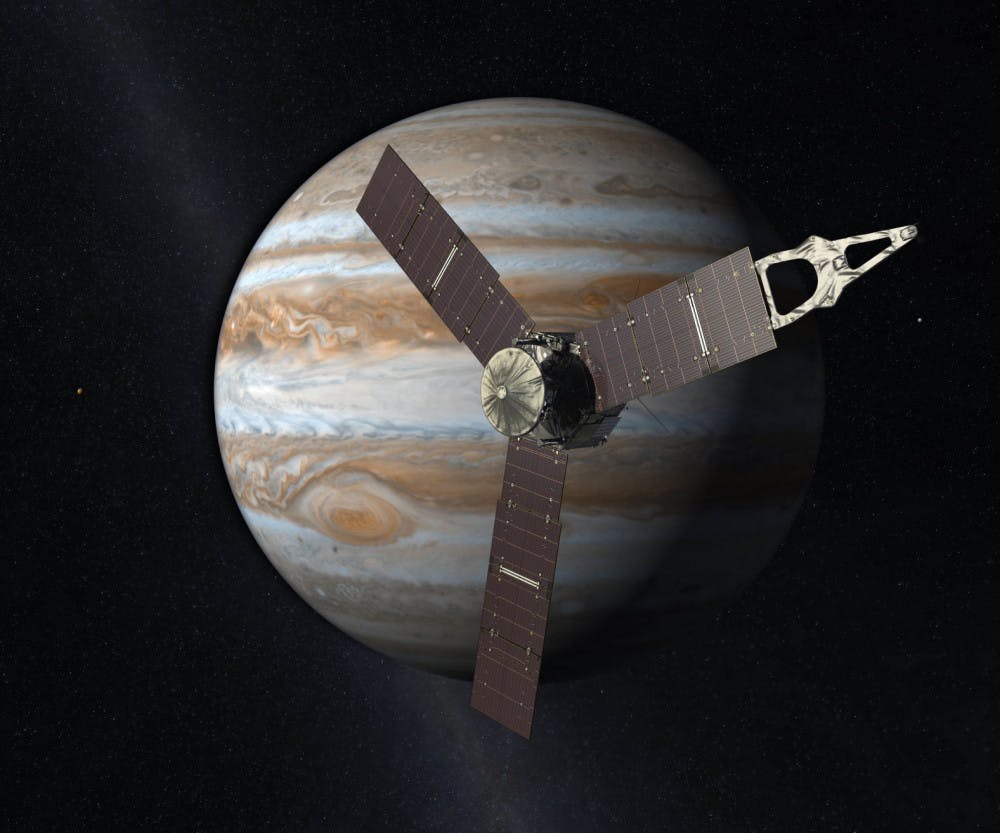 This artist's rendering provided by NASA and JPL-Caltech shows the Juno spacecraft above the planet Jupiter. Five years after its launch from Earth, Juno is scheduled to go into orbit around the gas giant on Monday, July 4, 2016. (NASA/JPL-Caltech via AP)