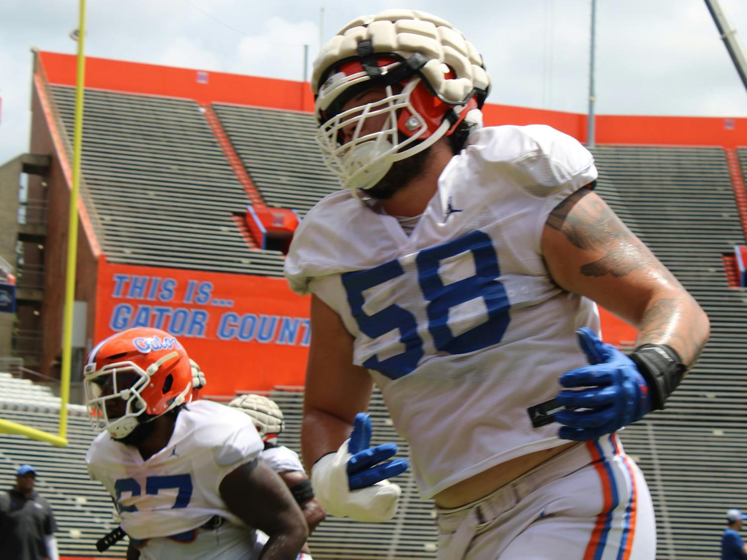 Offensive linemen redshirt sophomore Austin Barber and junior Richie Leonard IV compete in drills before Florida football’s Fall scrimmage Friday, Aug. 18, 2023. 