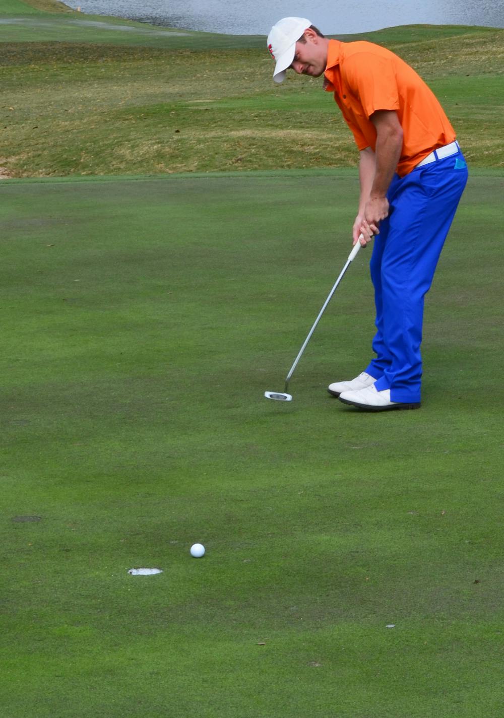 <p>Senior Tyler McCumber putts during the SunTrust Gator Invitational on Feb. 10 at Mark Bostick Golf Course.</p>