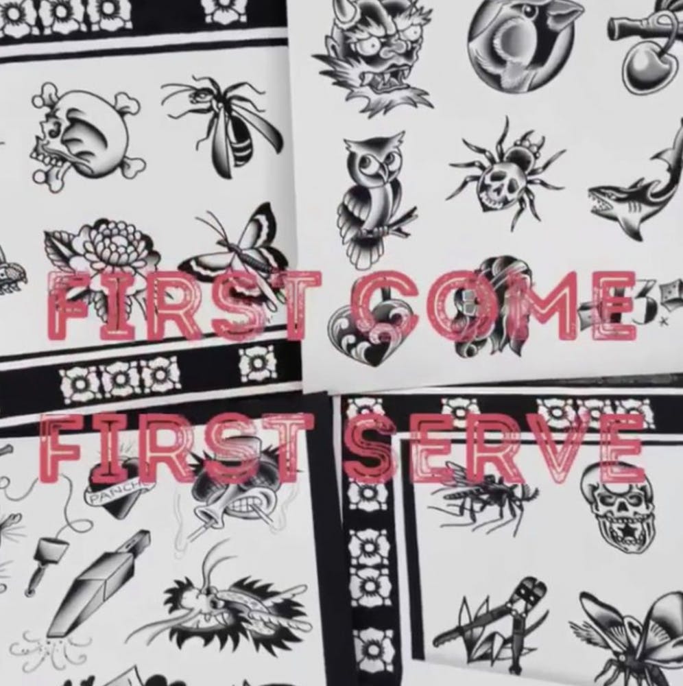 Tattoo artist Tim Strating displays his flash sheets for Anthem Tattoo's Friday the 13th event.