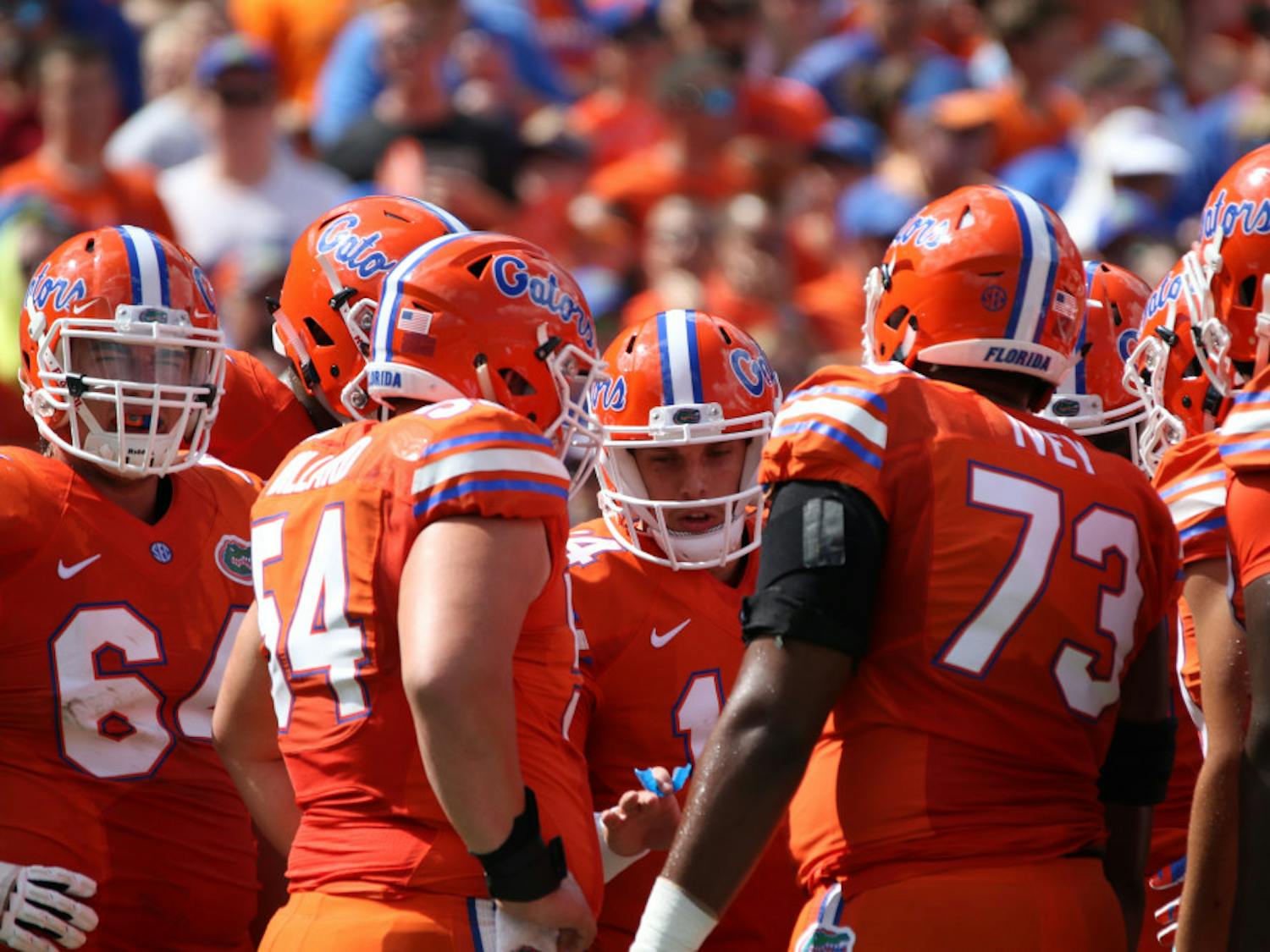 Luke Del Rio (center) huddles with Florida's offensive line during UF's 45-7 over Kentucky on Sept. 10, 2016, at Ben Hill Griffin Stadium.