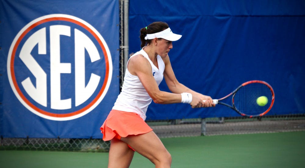 Ingrid Neel hits a backhand during Florida's 4-2 win against Oklahoma State on Feb. 18, 2017, at the Ring Tennis Complex.