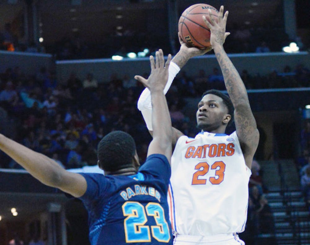 <p>Chris Walker attempts a shot during Florida’s 79-68 win&nbsp;in the Sweet 16 round of the NCAA Tournament against UCLA on March 27 in FedEx Forum in Memphis, Tenn.</p>