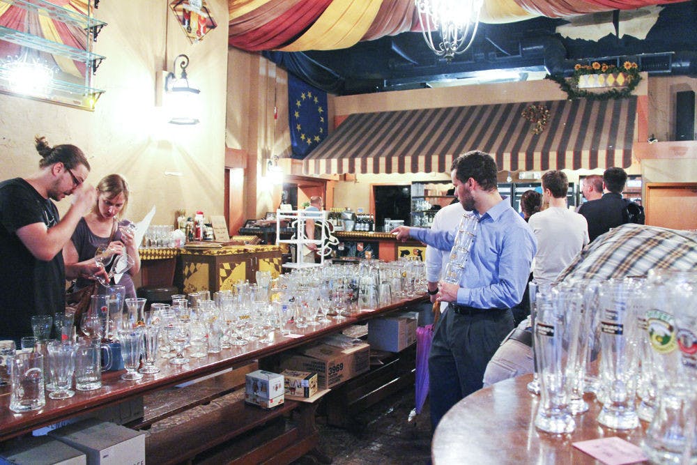 Customers search through glassware and memorabilia at the Stubbies &amp; Steins closeout sale Monday. The pub, which opened in 2003, closed on Saturday, leaving bargoers sad but thankful.