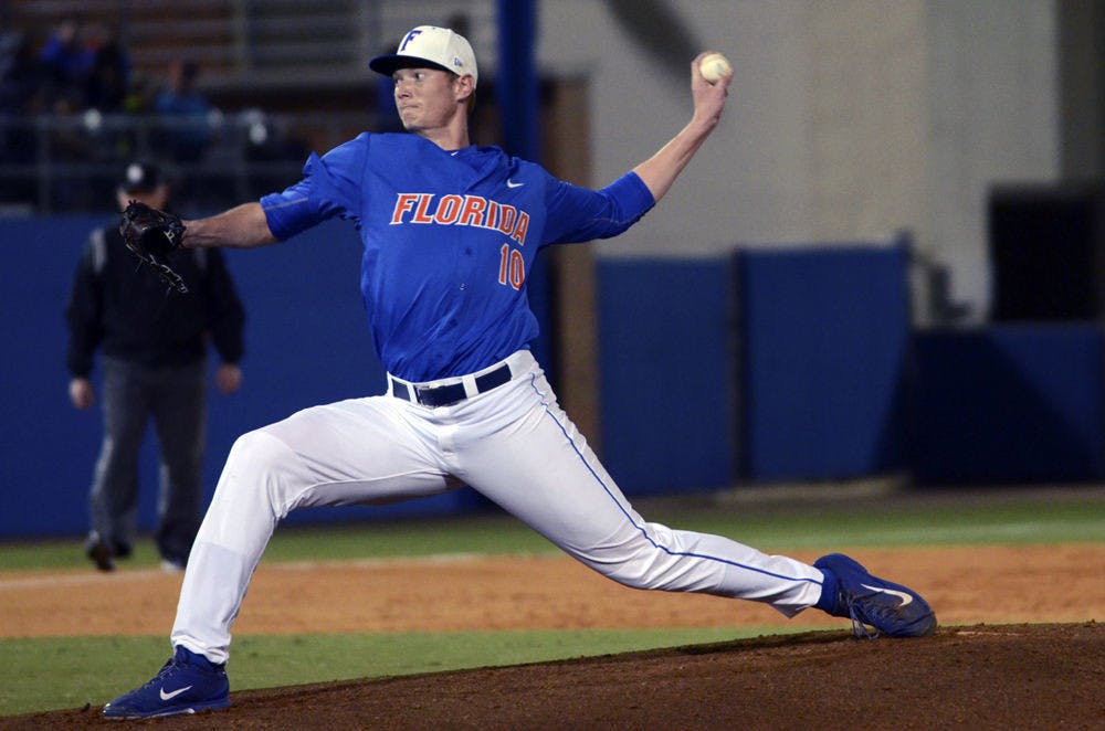 <p>A.J. Puk pitches during Florida's 7-2 loss to Miami on Feb. 21, 2015, at McKethan Stadium.</p>