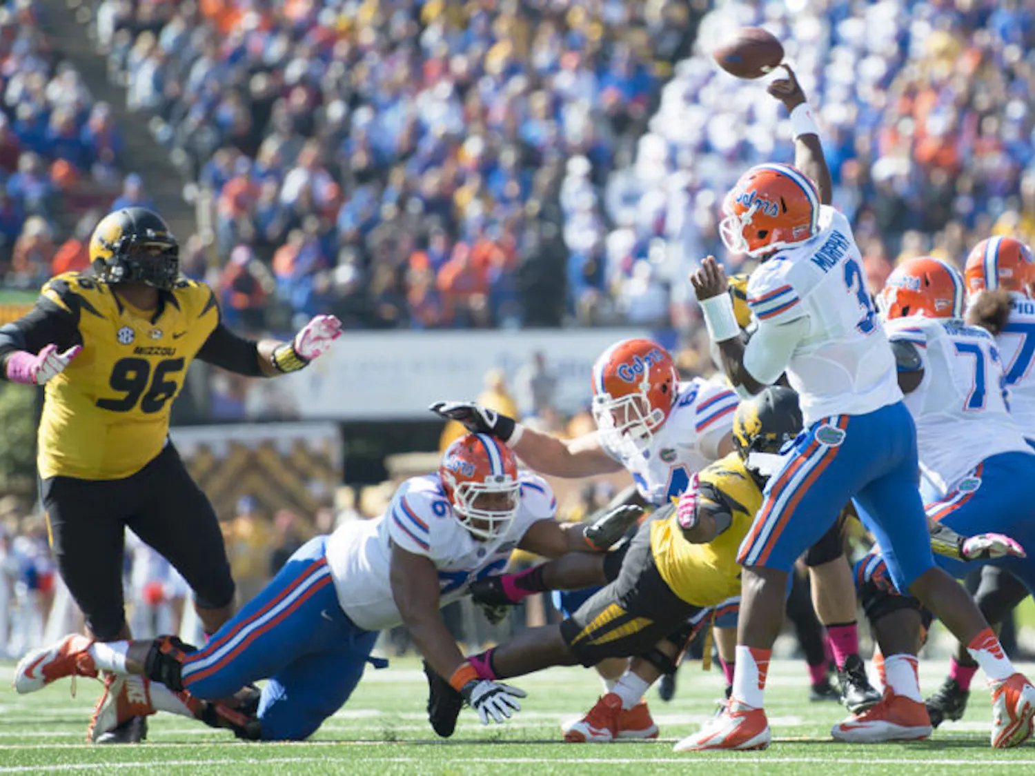 Max Garcia (76) lunges for a Missouri defender as redshirt junior quarterback Tyler Murphy (3) attempts a pass during Florida’s 36-17 loss to Missouri on Oct. 19 at Faurot Field in Columbia, Mo. UF’s line has allowed 10 sacks in the past two games.