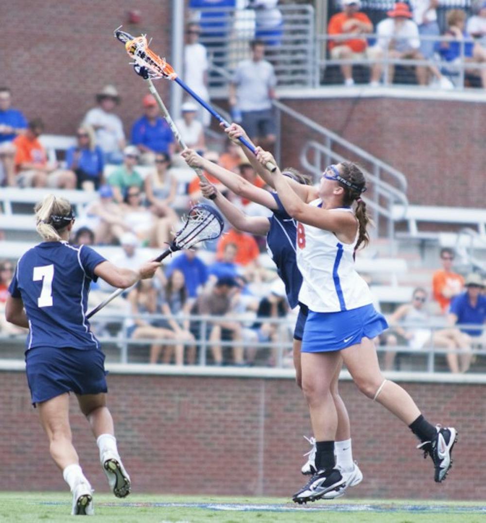 <p>Shannon Gilroy fights for possession against Penn State in Florida’s Elite Eight win Saturday. Gilroy scored two goals and led the Gators with six draw controls in the 15-2 victory.</p>
