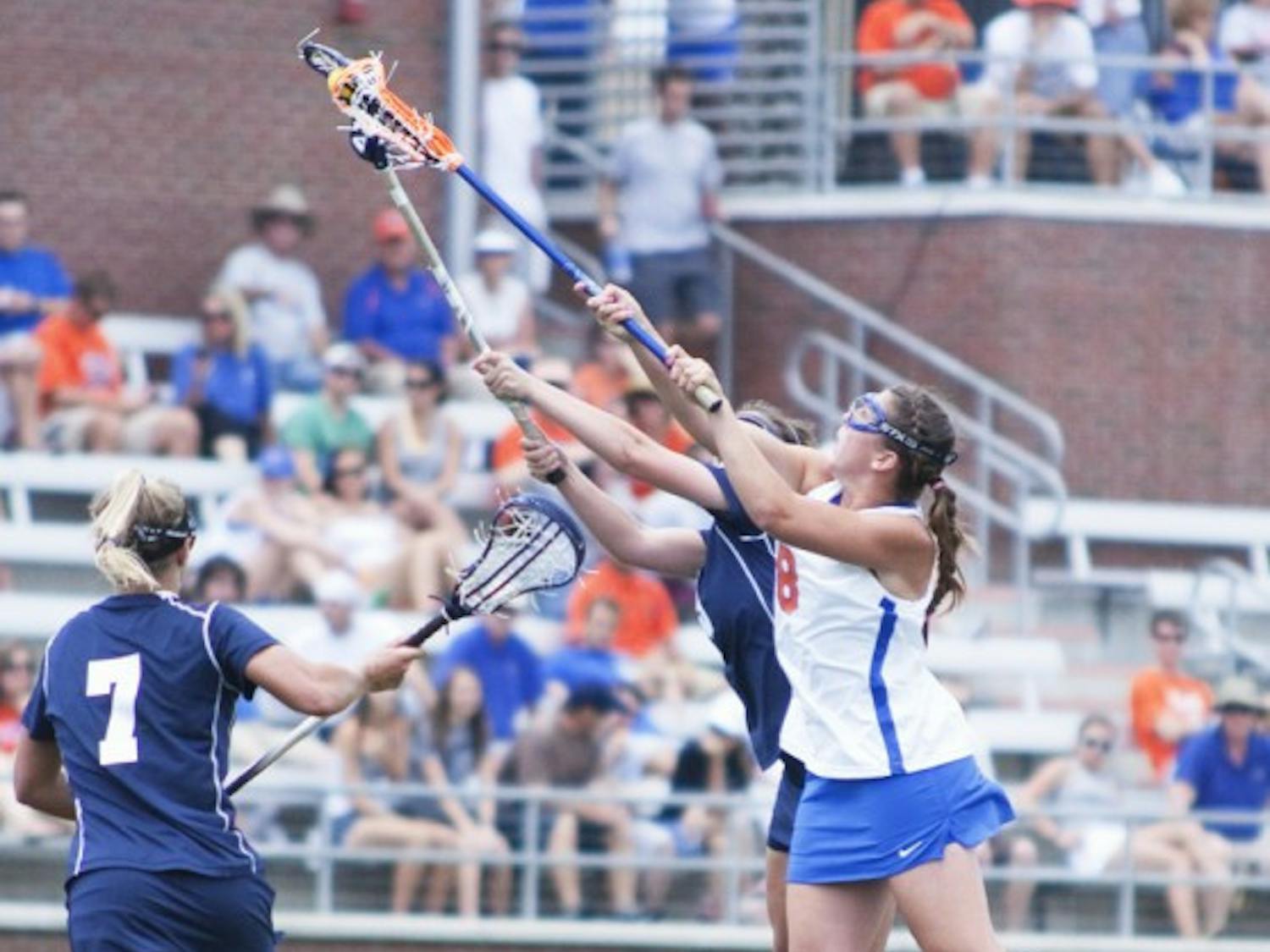 Shannon Gilroy fights for possession against Penn State in Florida’s Elite Eight win Saturday. Gilroy scored two goals and led the Gators with six draw controls in the 15-2 victory.
