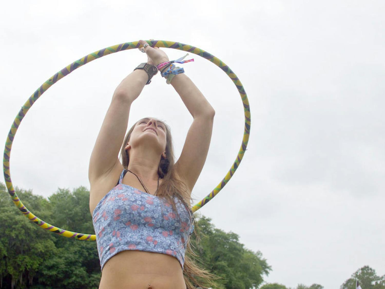 A Wanee Music Festival attendee dances with a hula hoop on Friday during instrumental gospel band The Word’s performance.