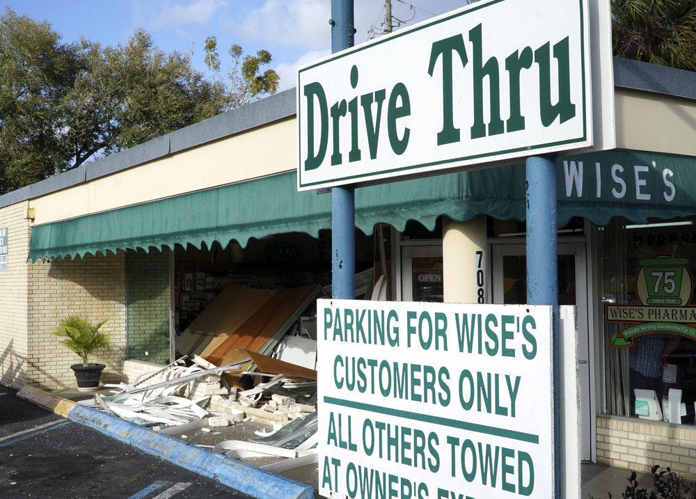 Pictured is the remaining damage to Wise’s Pharmacy storefront on Southwest 4th Avenue after a vehicle drove through the building. No one was hurt during the incident.