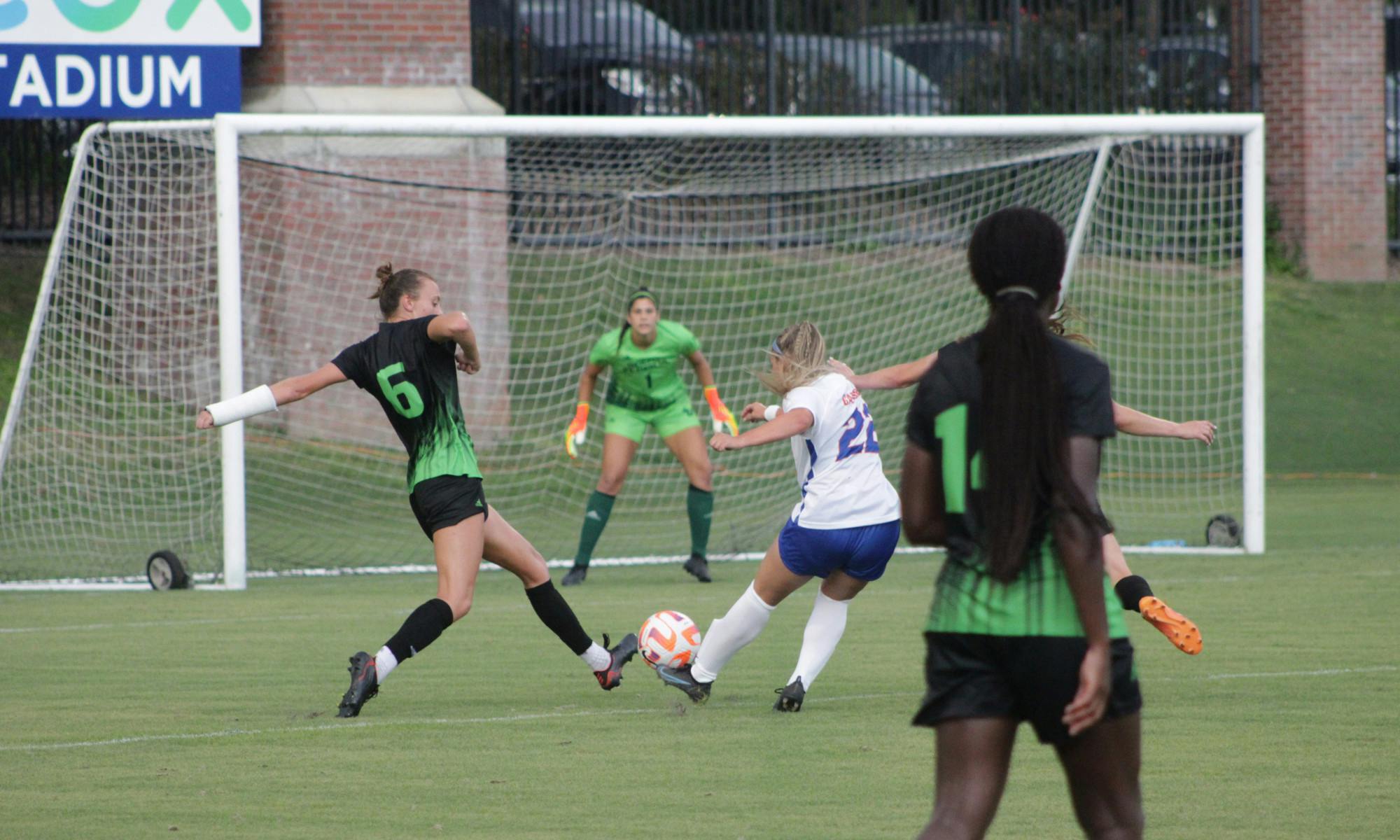 Redshirt freshman midfielder Oakley Rasmussen shoots against South Florida Sept. 1, 2021. 