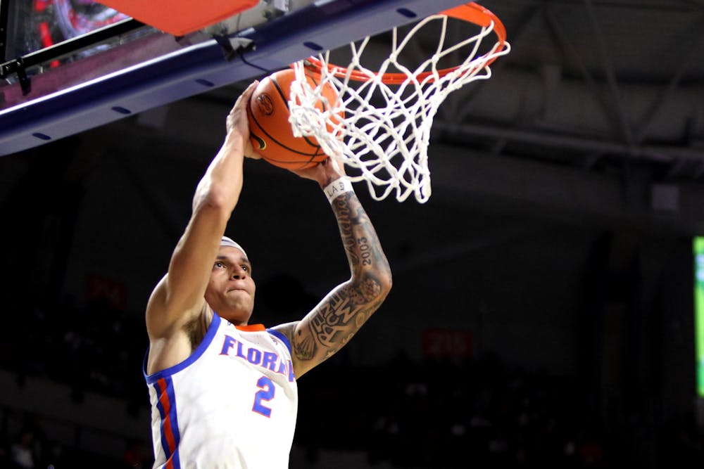 <p>Sophomore guard Riley Kugel rises up to dunk the ball in the Gators&#x27; 93-73 win against the Loyola Maryland Greyhounds on Monday, Nov. 6, 2023.</p>