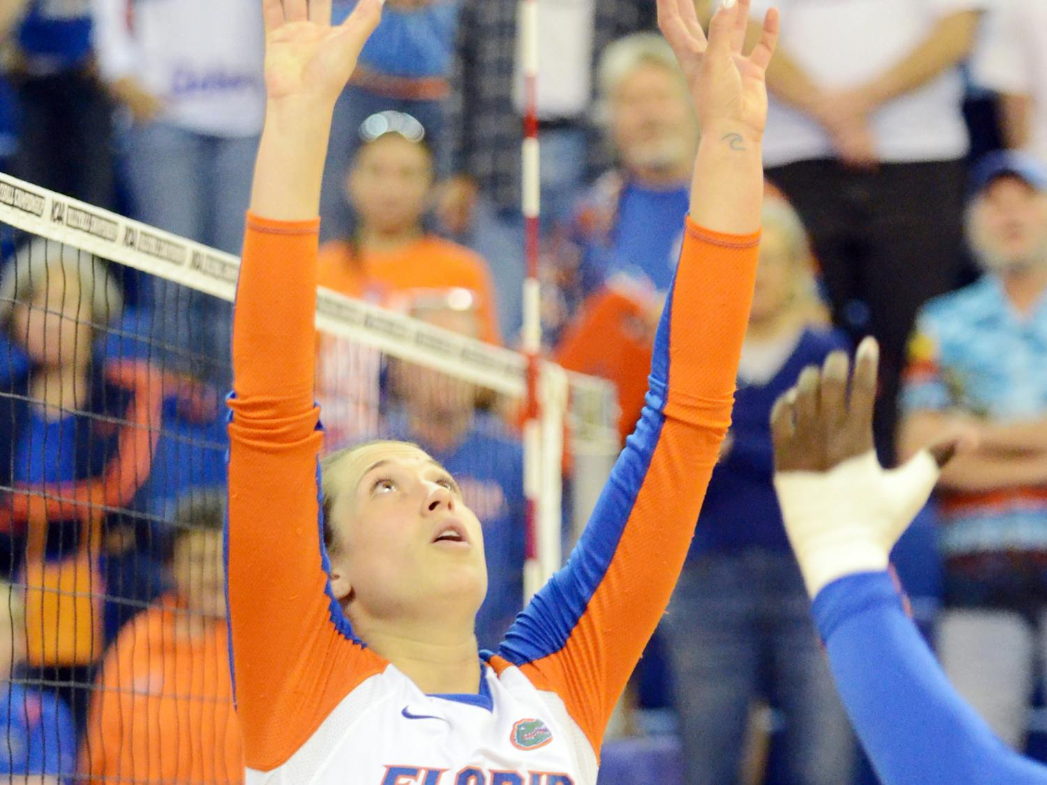 Mackenzie Dagostino sets the ball during Florida's 3-0 win against Alabama State during the first round of the NCAA Tournament on Friday in the O'Connell Center.