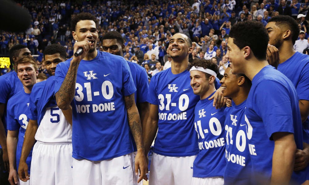 <p>Kentuck's Willie Cauley-Stein, third from left, address the crowd during a ceremony marking the teams undefeated season after the Wildcats' 67-50 win against Florida on Saturday at Rupp Arena in Lexington, Kentucky.</p>