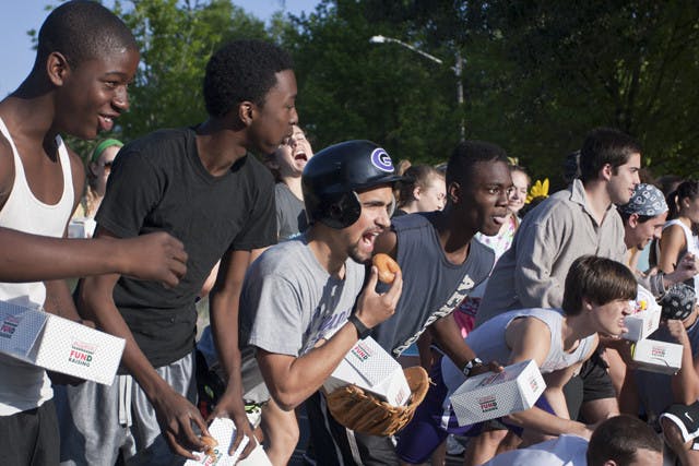 Racers take their marks at the start of the doughnut race in Westwood Middle School's parking lot at about 8:45 a.m. on Saturday. Participants had to eat a dozen doughnuts and run two miles.