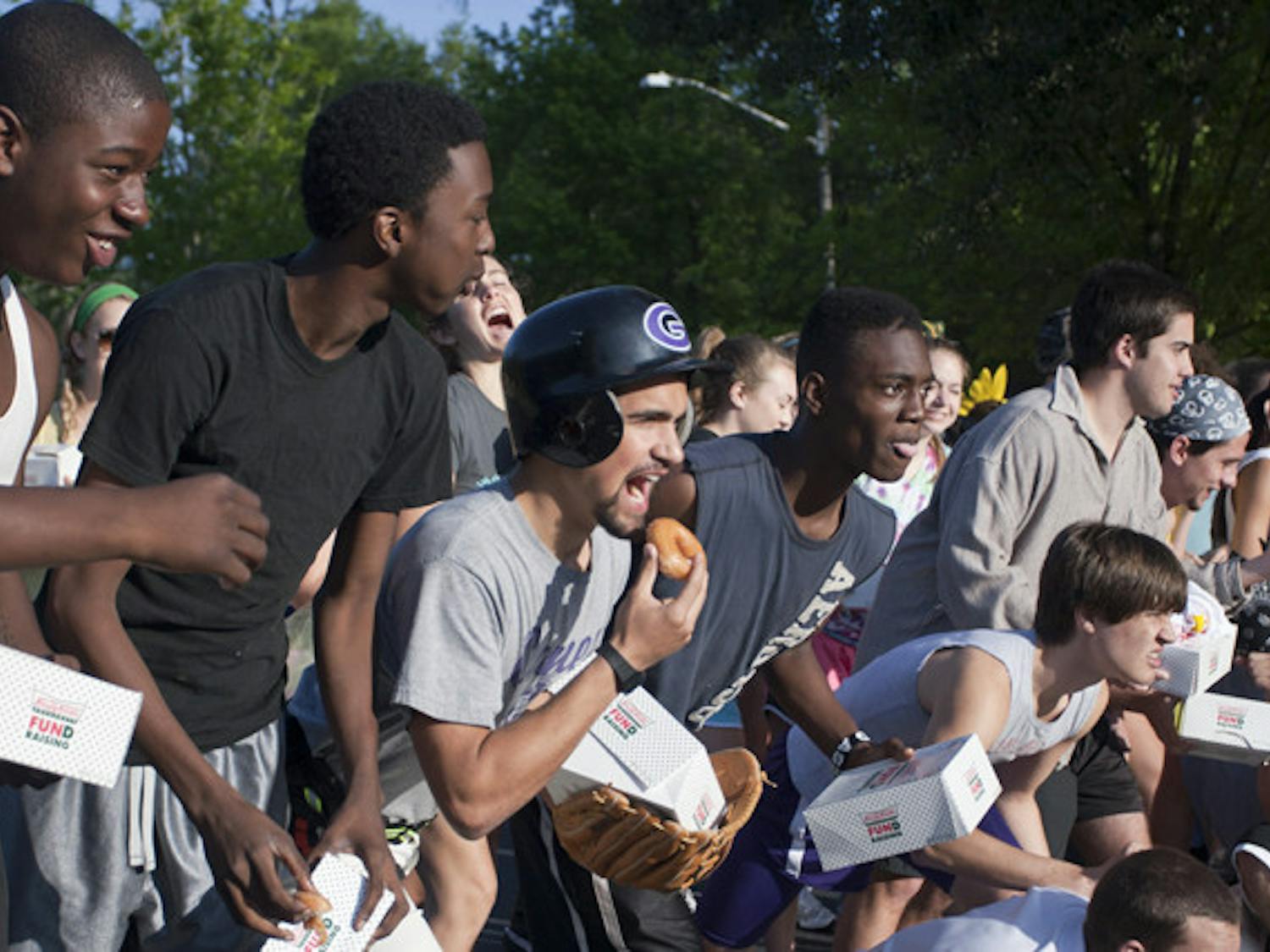 Racers take their marks at the start of the doughnut race in Westwood Middle School's parking lot at about 8:45 a.m. on Saturday. Participants had to eat a dozen doughnuts and run two miles.