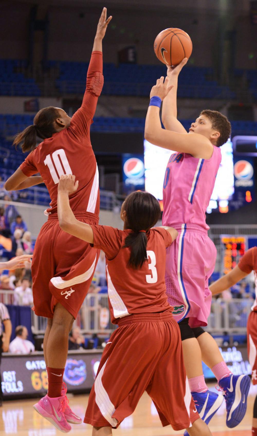 <p class="p1"><span class="s1">Freshman guard Sydney Moss (right) attempts a shot during Florida’s 87-54 victory against Alabama on Feb. 3 in the O’Connell Center. Moss announced that she will transfer from Florida on Tuesday.</span></p>