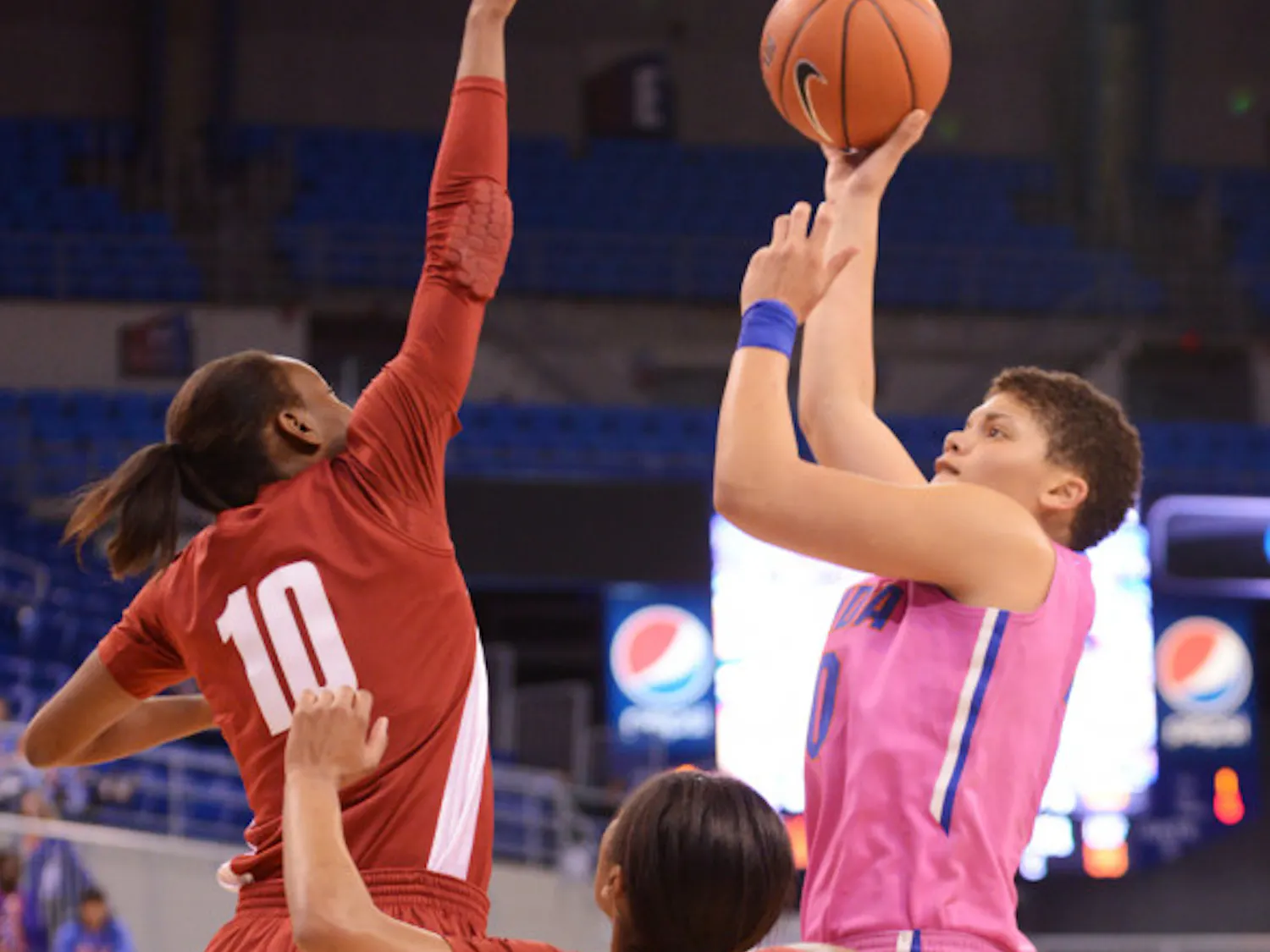 Freshman guard Sydney Moss (right) attempts a shot during Florida’s 87-54 victory against Alabama on Feb. 3 in the O’Connell Center. Moss announced that she will transfer from Florida on Tuesday.