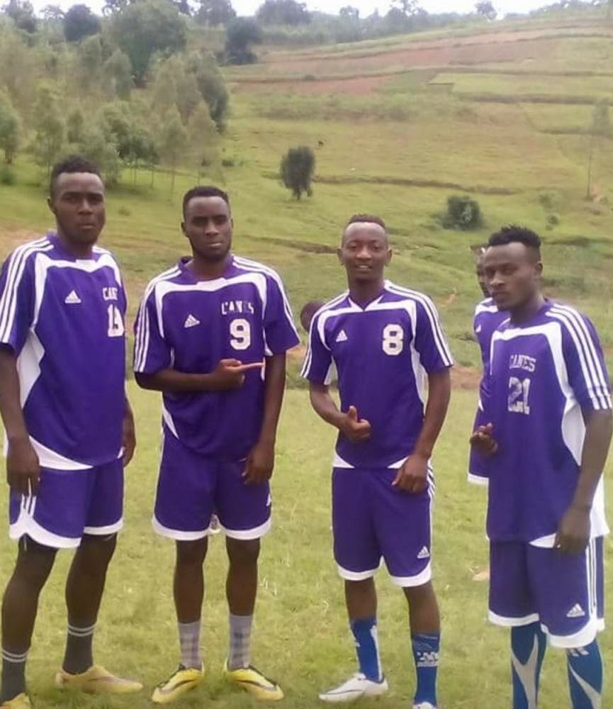 The Hurricanes For Jesus soccer team pose with their Gainesville High School soccer uniforms.