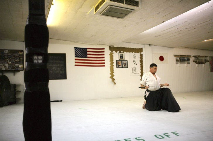 Sensei Tom Huffman, a fourth-degree black belt in Iwama and Nishio styles of aikido, practices iaido at the Unified Training Center on Thursday. Iaido is the art of drawing and manipulating the Japanese sword. Adult classes are held Mondays and Wednesdays at 7:30 p.m. Free classes are held each Thursday at 7:30 p.m.