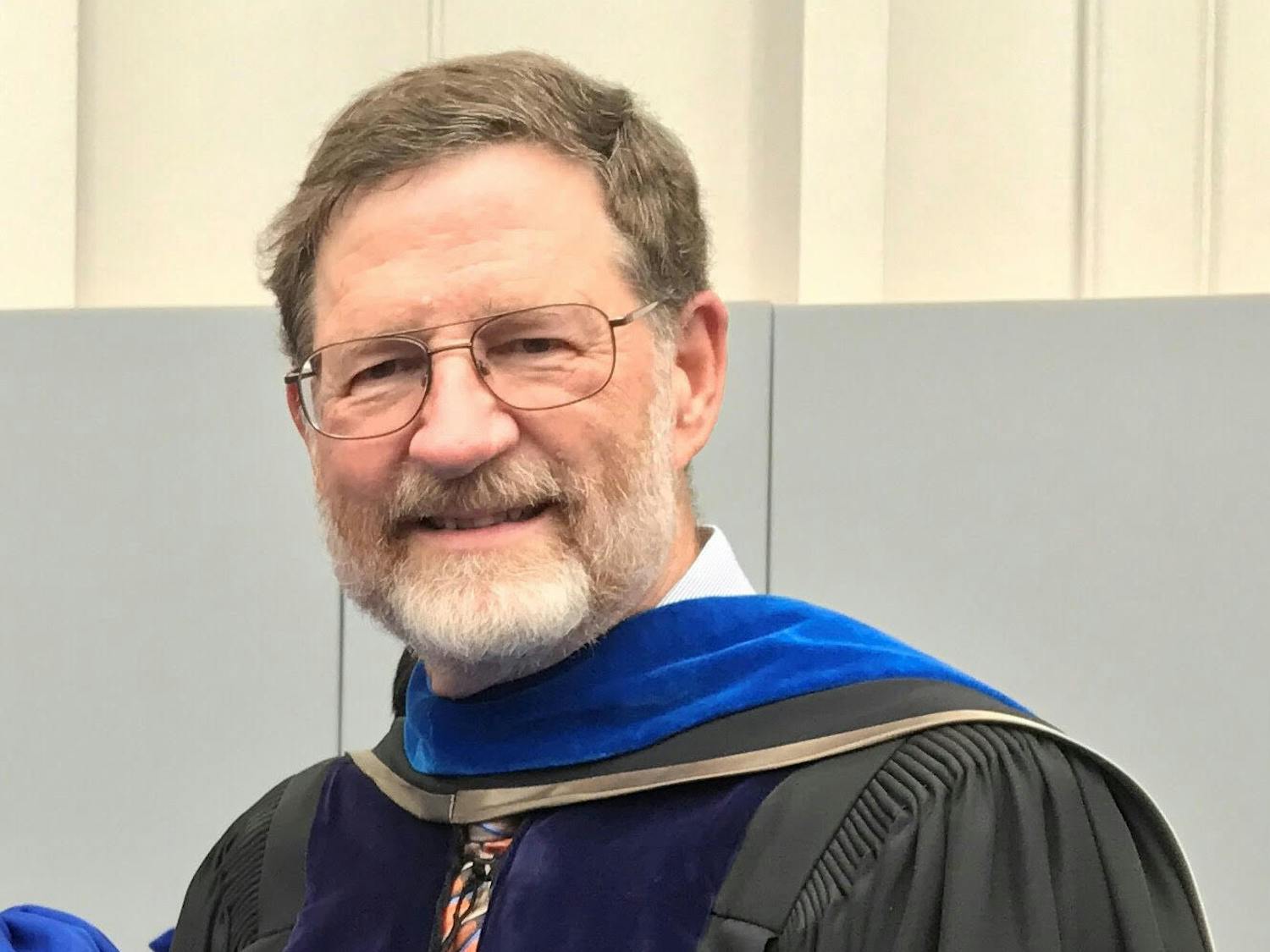 Richard Yost, 66, pictured in April 2019 at a PhD commencement ceremony where he escorted his most recent PhD graduate student.