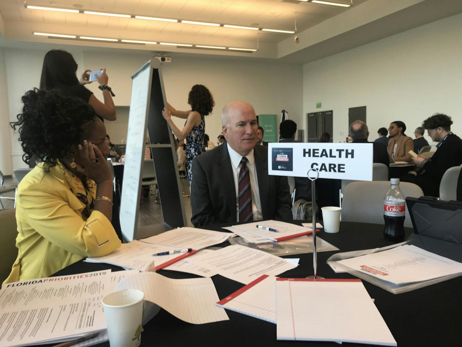 Former Executive Director of We Care Manatee Victoria Kasdan (left) and group CEO of Florida Medical Center and Tenet Health Miami-Dade Group Jeffrey Welch (right) discuss ways Florida can improve its healthcare system during the Florida Priorities Summit. 