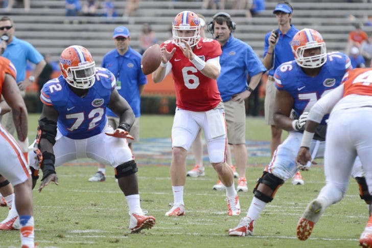 Junior quarterback Jeff Driskel (6) takes a snap during a drill in Saturday’s Orange and Blue Debut at Ben Hill Griffin Stadium. The event marked the end of Florida’s spring practice.