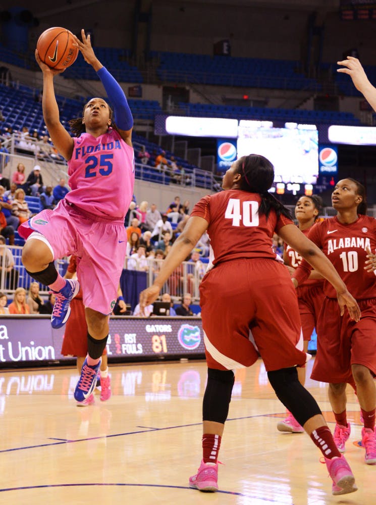 Freshman Christian Mercer (25) attempts a shot during Florida’s 87-54 victory against Alabama on Sunday in the O’Connell Center.