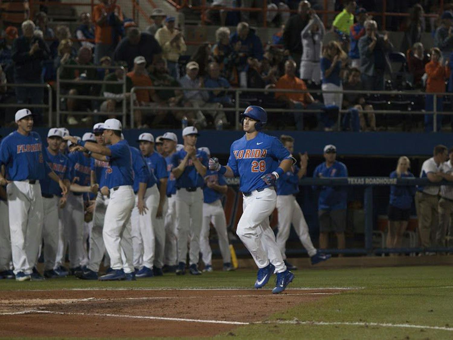 UF catcher Mark Kolozsvary rounds the bases after hitting a home run in Florida's 2-0 win against Miami on Feb. 25, 2017, at McKethan Stadium.