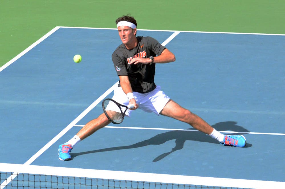 <p>Gordon Watson hits an underhand volley during Florida men's tennis' 4-3 loss to Ole Miss on Jan. 31, 2015 at the Ring Tennis Complex.</p>