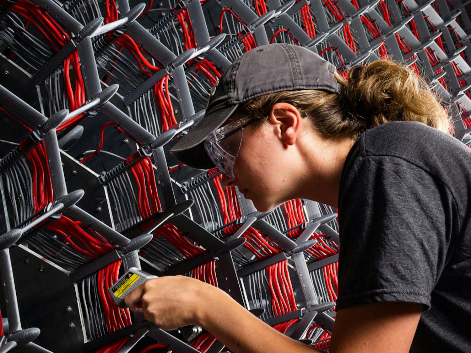 A student enrolled in the National Science Foundation's Research Experience for Undergraduates program works on one of the fans