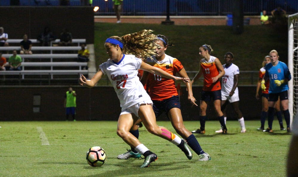 <p>Mayra Pelayo controls the ball with a defender behind her during Florida's 2-1 win against Syracuse on Aug. 27, 2017, at Donald R. Dizney Stadium.</p>
