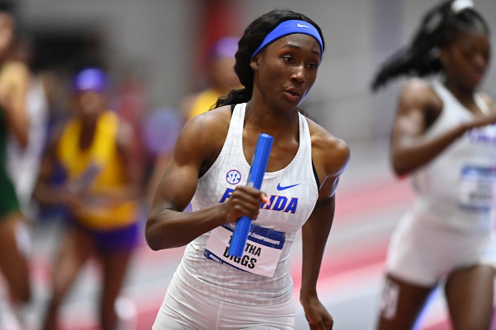 Florida's Talitha Diggs runs during the third day at the NCAA Indoor Championships on Saturday, March 13, 2021 at Randal Tyson Track Center in Fayetteville, Ark. / UAA Communications photo by NCAA Images