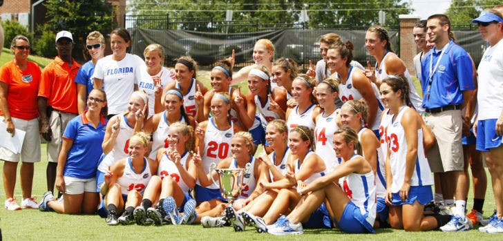 The Florida lacrosse team takes a group photo after winning the American Lacrosse Conference tournament with a 14-7 victory against Northwestern in the final on May 5 at Dizney Stadium.
