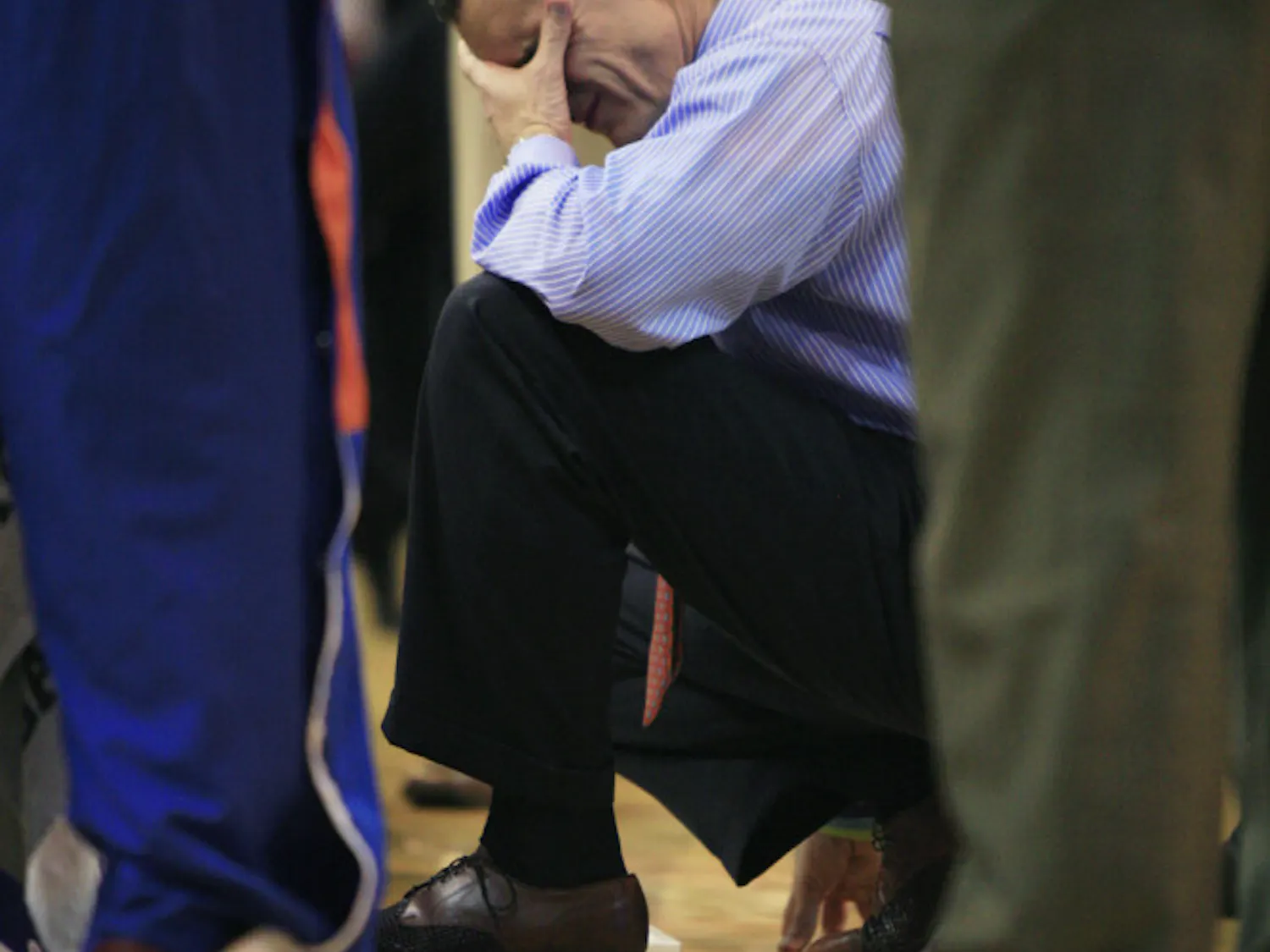 Coach Billy Donovan rubs his eyes during a timeout in Florida’s 71-54 win against Arkansas on Saturday in the O’Connell Center.