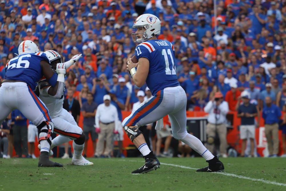 Kyle Trask drops back to pass and scans the field during the Gators' 24-13 win over Auburn last season. Florida's 10-game, conference-only schedule begins on Sept. 26 against Ole Miss.
