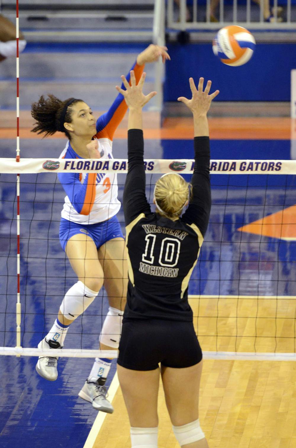 Alex Holston hits the ball during Florida’s four-set win against Western Michigan on Sept. 14 in the O’Connell Center.