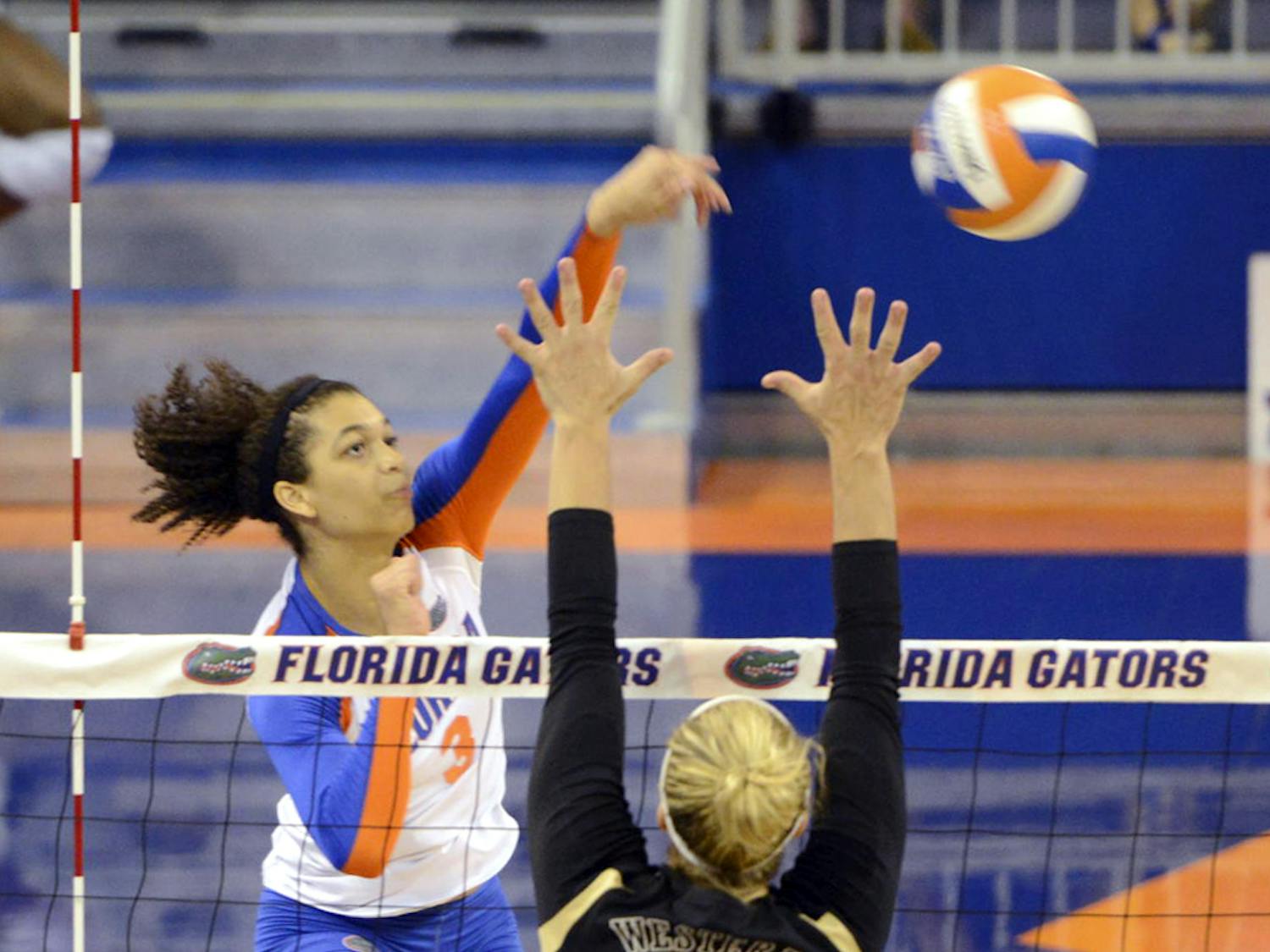 Alex Holston hits the ball during Florida’s four-set win against Western Michigan on Sept. 14 in the O’Connell Center.