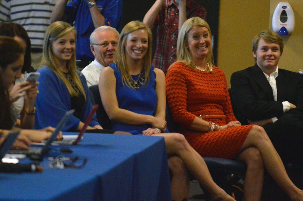 Daughters Elizabeth McElwain (from left) and Johanna McElwain, wife Karen McElwain and son Jerret McElwain listen to their father's introductory press conference on Saturday in Ben Hill Griffin Stadium.