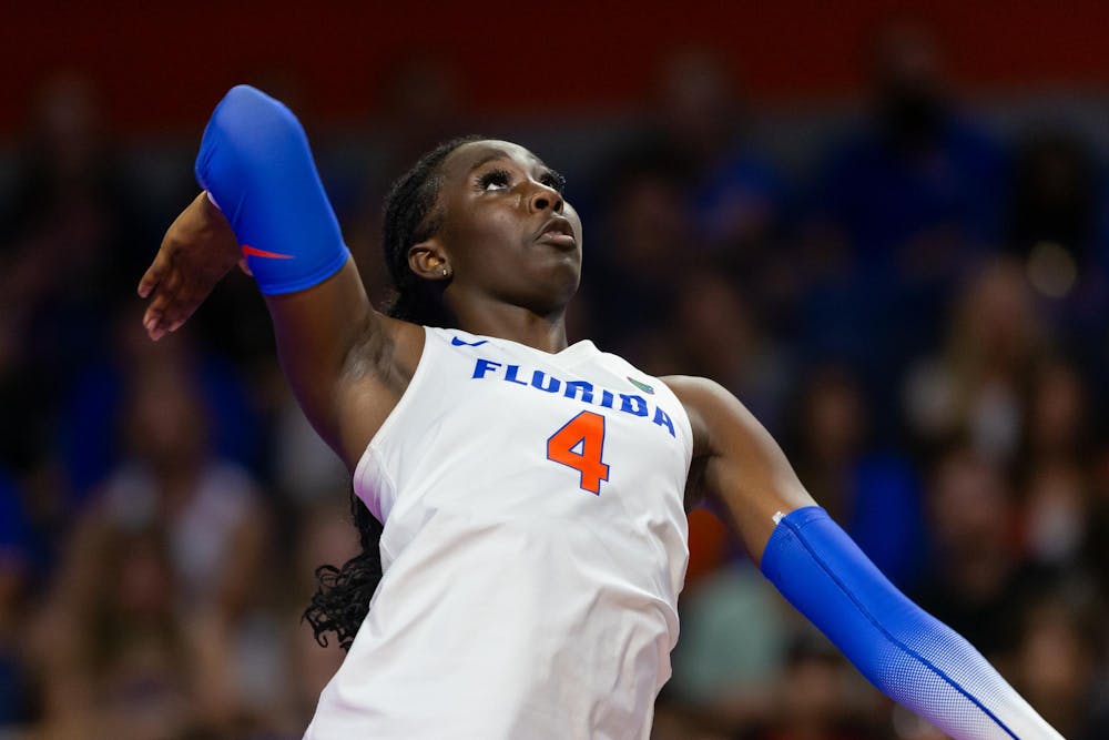 Florida middle blocker Jaela Aguste prepares to hit the ball during the second set of their match vs the USF Bulls on Friday, Sept. 6.