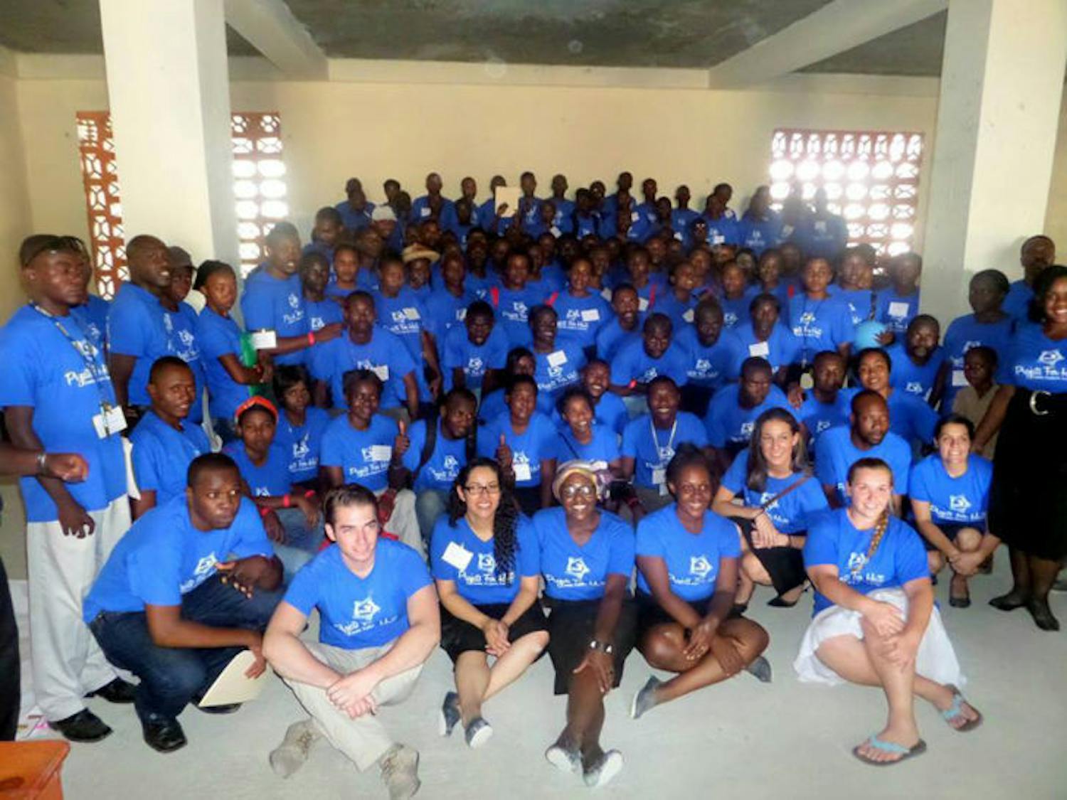 Pictured are 135 teachers from the conference held by Projects for Haiti. The event helps them network and improve teaching skills through workshops and training exercises.