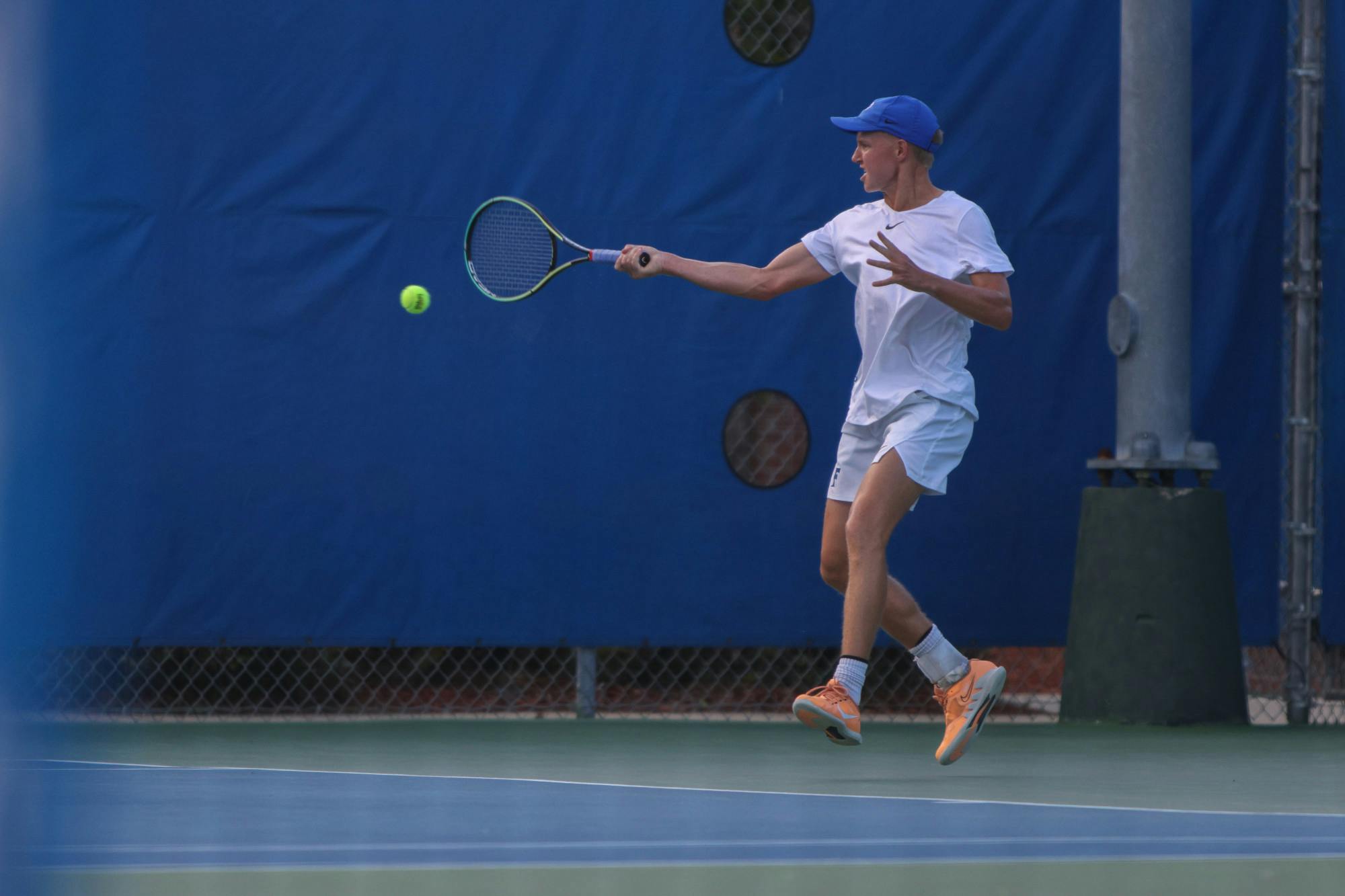 Florida senior Lukas Greif hits the ball with his racket during the Gators' 6-1 win over the Arkansas Razorbacks Friday, March 24, 2023.