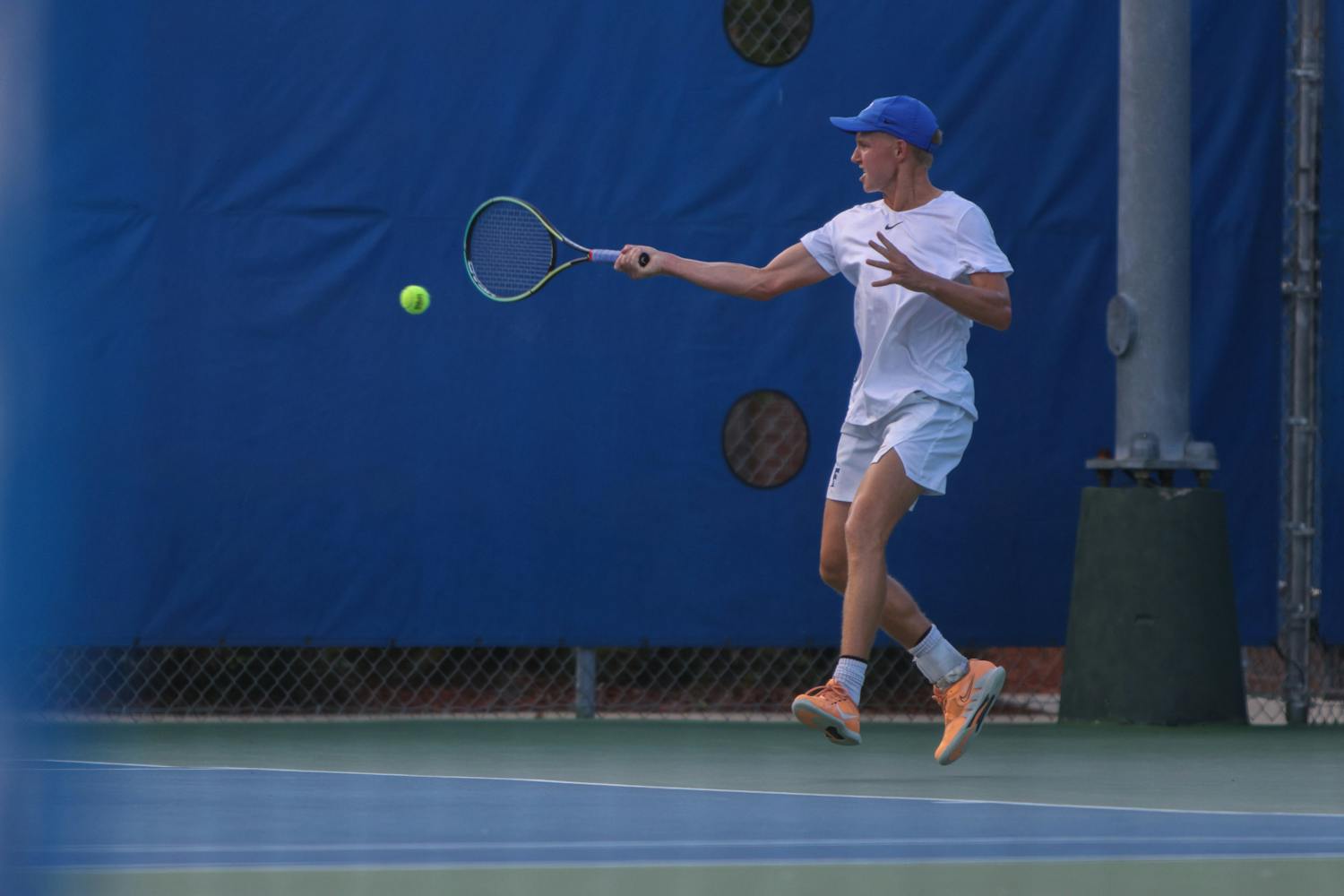 Florida senior Lukas Greif hits the ball with his racket during the Gators' 6-1 win over the Arkansas Razorbacks Friday, March 24, 2023.