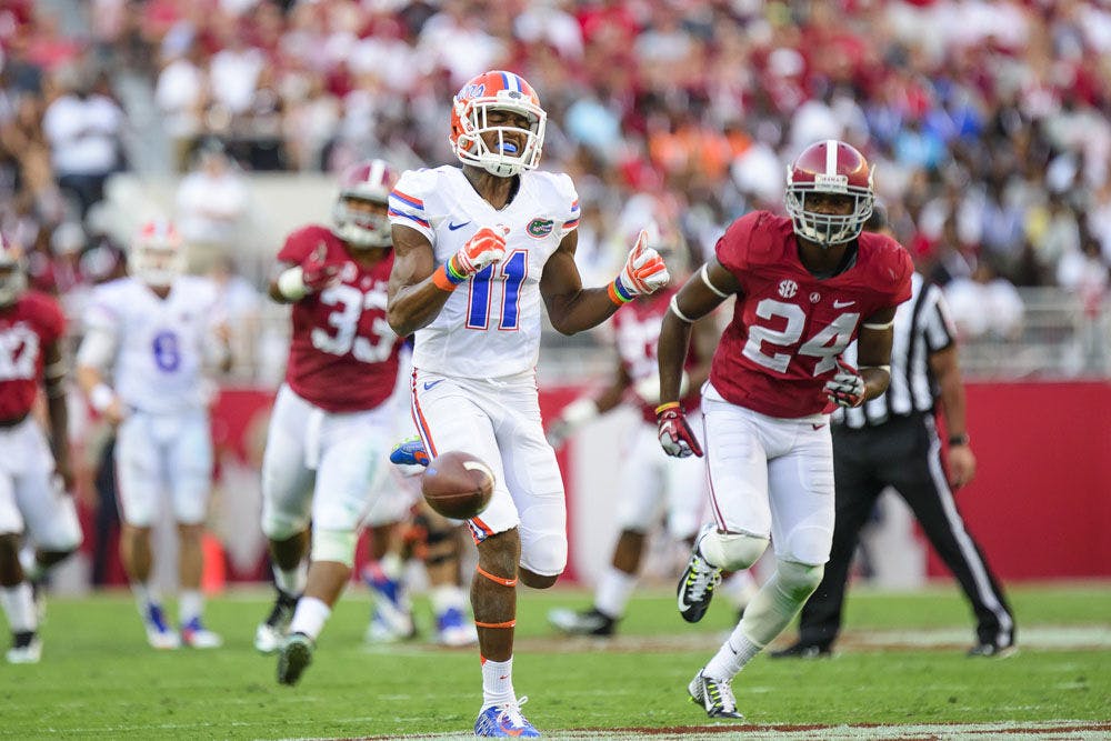 <p>Demarcus Robinson (11) reacts after an incompleted pass during Florida's 21-42 loss to Alabama on Saturday at Bryant-Denny Stadium.</p>
