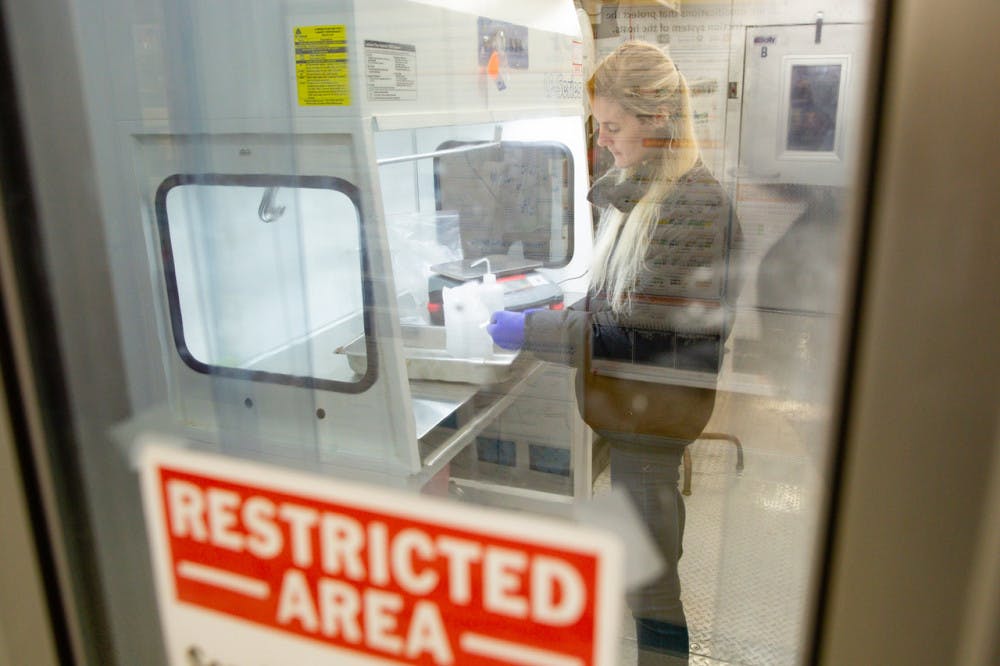 <p>Christina Davis working in a microbiology and cell science lab in preparation for field work in Antarctica on Tuesday, November 20th, 2018.</p>